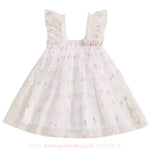 Vestido infantil branco com tule estampado de coelhinhos, detalhe das alças franzidas e saia volumosa. 