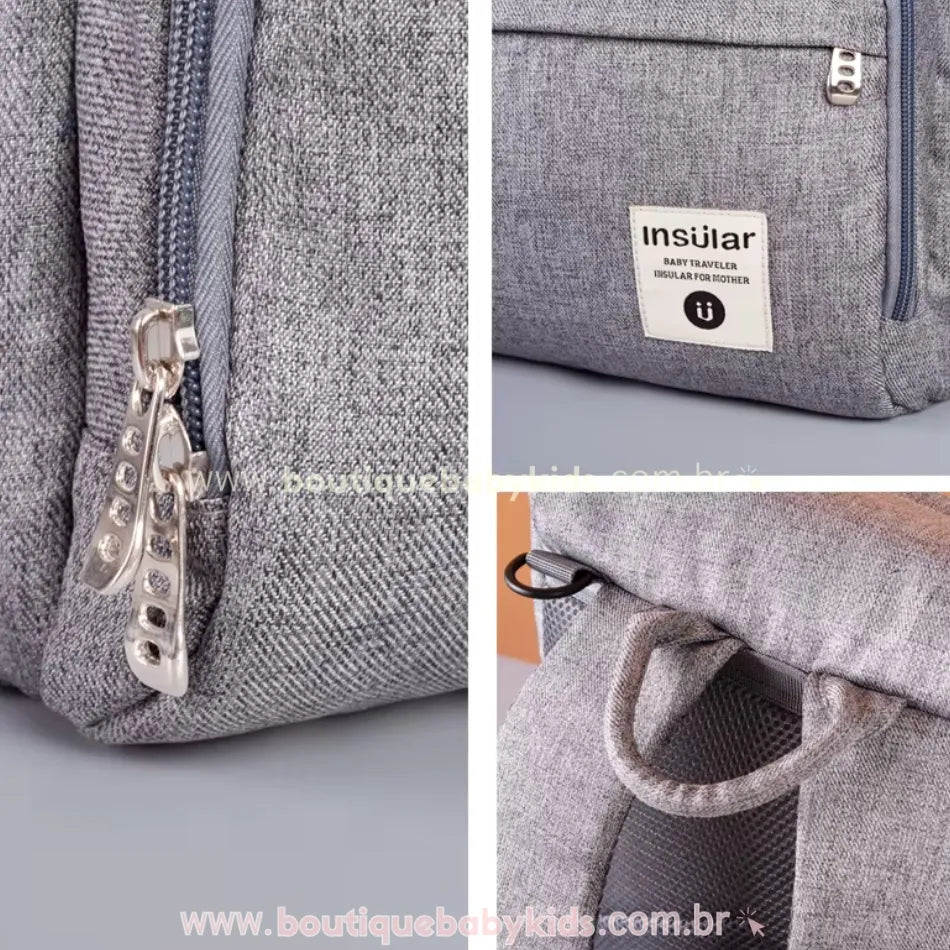 Detalhes da mochila maternidade Insular Travel, incluindo zíper metálico, alça superior reforçada e acabamento em tecido resistente.