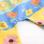 Parte inferior do macacão bebê com abertura em botões de pressão, prática para troca de fraldas.