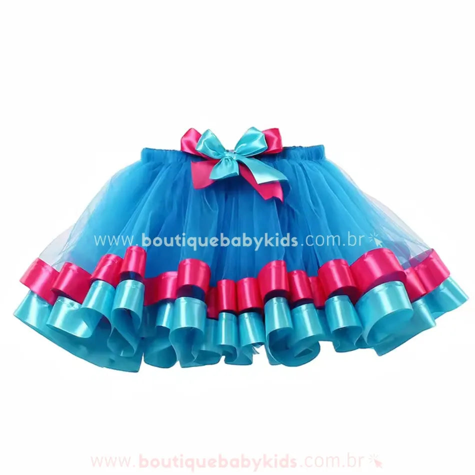 Saia infantil temática Poppy Trolls vista de frente, com elástico na cintura e laço central decorativo combinando com as fitas da barra.