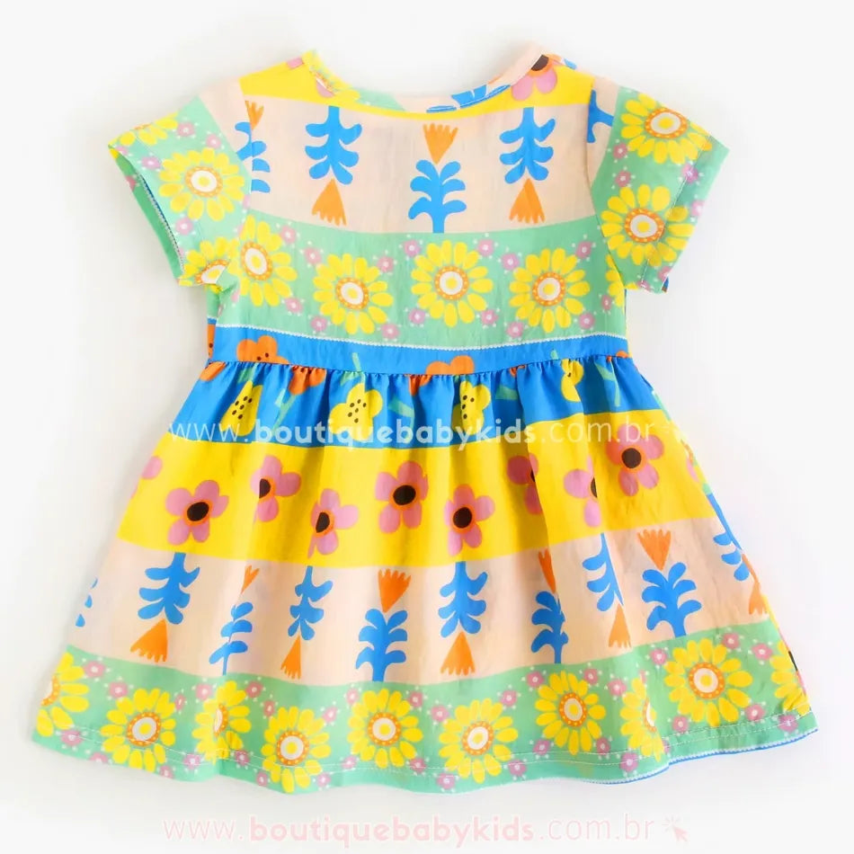 Parte traseira do vestido infantil com estampa de flores e folhagens coloridas. - Boutique Baby Kids
